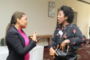 Isioma Okobi of PMU & Awele Okigbo Communications Consultant PMU having a chat