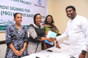 L-R, Component Head SHS ,REA, Ifunanya Nwandu-Dozie, MD-CEO Rural Electrification Agency, Damilola Ogunbiyi ,Head Project Management Unit, REA ,Adejoke Odumosu and Managing Director A4&T Power Solution Limited, Mr Ayo Ademilua receiving a copy of the Signed Grant Agreement during the event