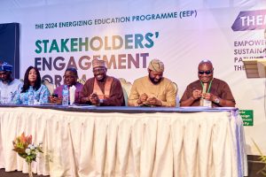 Abba Abubakar Aliyu - Managing Director_CEO, REA; and Olufemi Akinyelure - Head, Nigeria Electrification Project, share a laugh with Professor Akpofure Rim-Rukeh - Vice Chancellor, FUPRE, as they sign the collabora